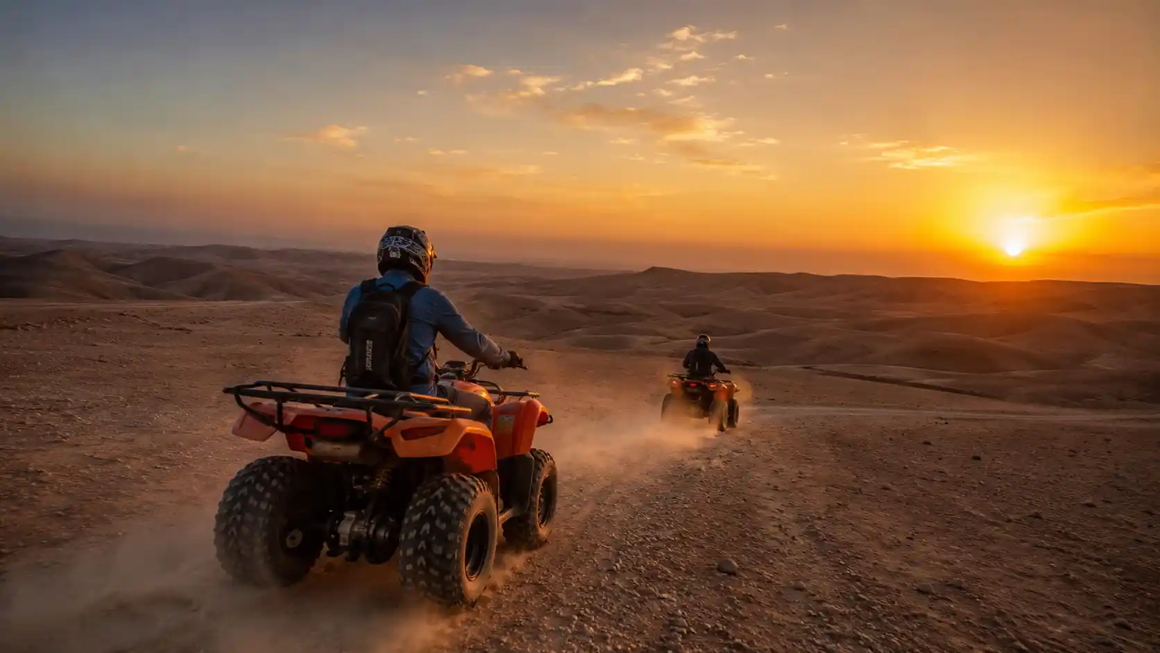 Quad biking through the Agafay Desert at sunset